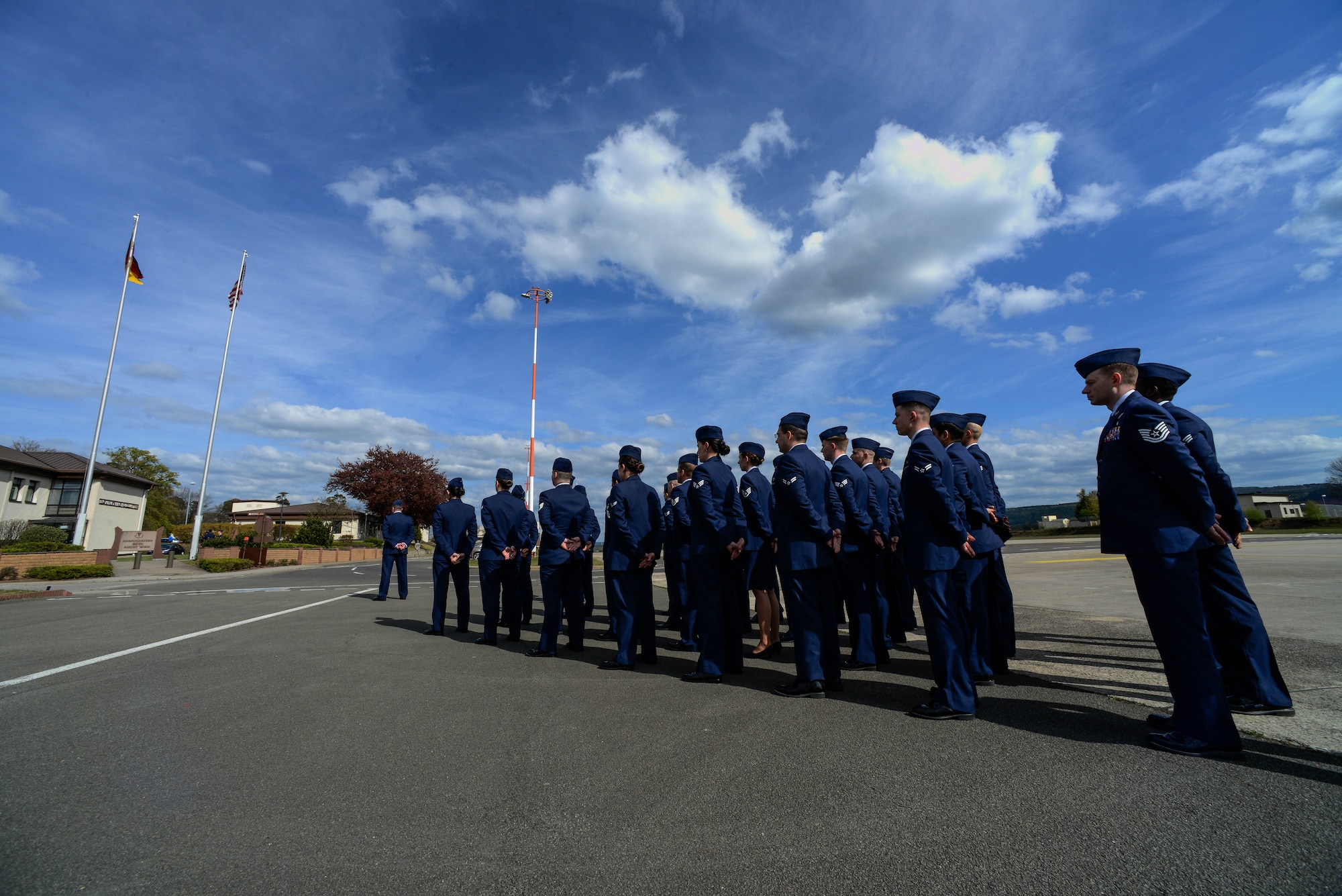 Airmen from the 86th Operations Group stand in a formation before a retreat and remembrance ceremony April 29, 2016, at Ramstein Air Base, Germany.  Airmen from the 86th OG gathered for the ceremony to recognize the Implementation Force 21 crew from the 76th Airlift Squadron who gave the ultimate sacrifice 20 years ago when their aircraft was lost during an approach into Dubrovnik, Croatia. (U.S. Air Force photo/Senior Airman Nicole Keim)