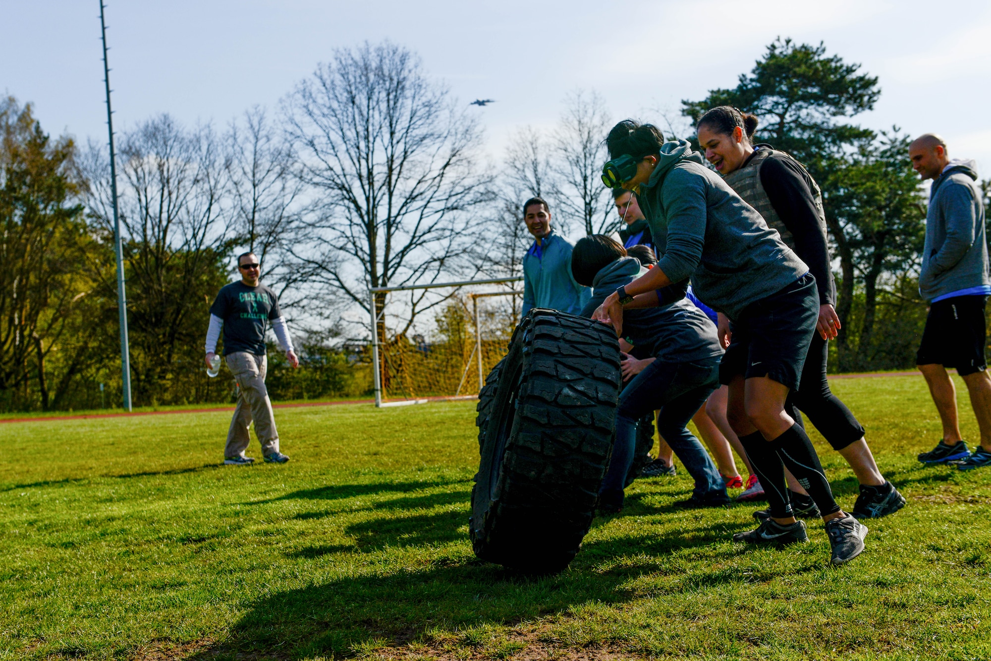 A team of Soldiers flip a tire during the Courage, Leadership, Education, Advocate and Respect course April, 29, 2016, at Vogelweh Military Complex, Germany. The CLEAR challenge is an annual obstacle course designed to symbolize the effects of sexual assault and alcohol abuse. During the course participants wore “drunk goggles” to show them how dangerous functioning under the influence of alcohol can be and how it can impair decisions. (U.S. Air Force photo/Senior Airman Nicole Keim)