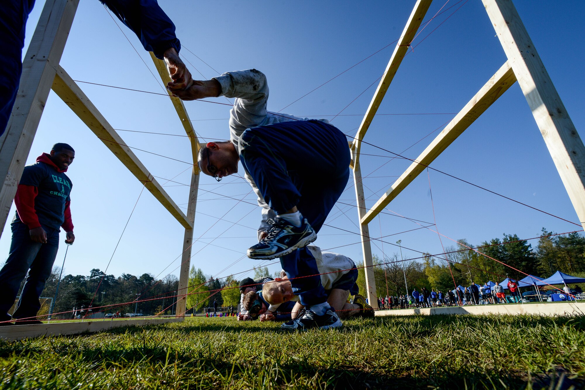 Airmen participate in the Courage, Leadership, Education, Advocate and Respect course April, 29, 2016, at Vogelweh Military Complex, Germany. The CLEAR challenge is an annual obstacle course designed to symbolize the effects of sexual assault and alcohol abuse. During the course participants wore “drunk goggles” to show them how dangerous functioning under the influence of alcohol can be and how it can impair decisions. (U.S. Air Force photo/Senior Airman Nicole Keim)
