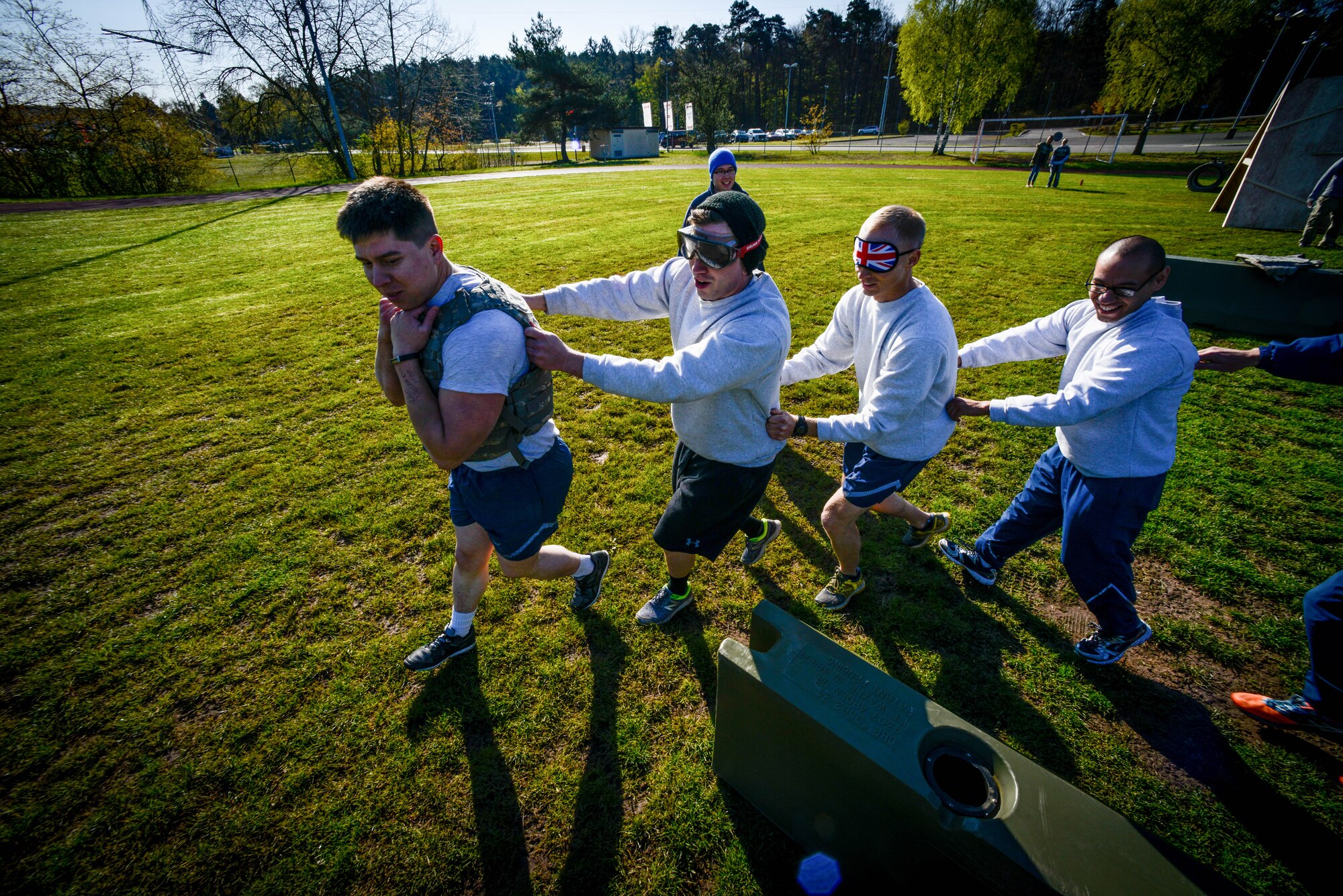 Airmen participate in the Courage, Leadership, Education, Advocate and Respect course April, 29, 2016, at Vogelweh Military Complex, Germany. The CLEAR challenge is an annual obstacle course designed to symbolize the effects of sexual assault and alcohol abuse. During the course participants wore “drunk goggles” to show them how dangerous functioning under the influence of alcohol can be and how it can impair decisions. (U.S. Air Force photo/Senior Airman Nicole Keim)