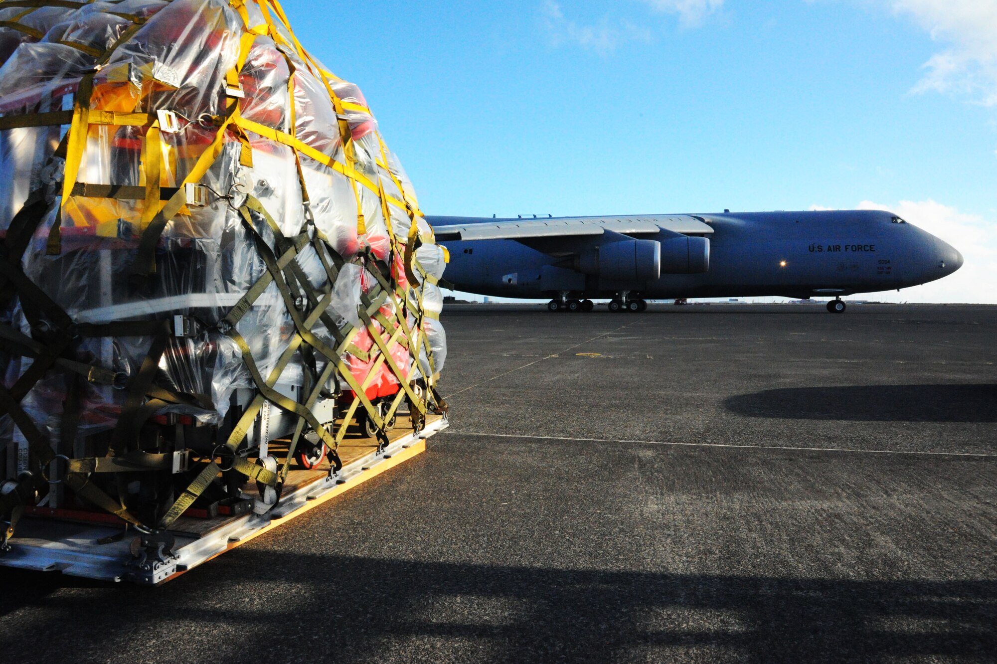 A U.S. Air Force C-5 Galaxy cargo aircraft taxis from the flightline at Keflavik International Airport, April 28, 2016 as equipment sits ready to be loaded. The equipment and approximately 200 Airmen assigned to the 104th Fighter Wing, Barnes Air National Guard Base, Mass., completed the Icelandic Air Surveillance mission and will travel to Estonia to conduct training and partnership operations there. (U.S. Air Force photo by Master Sgt. Kevin Nichols/Released)
