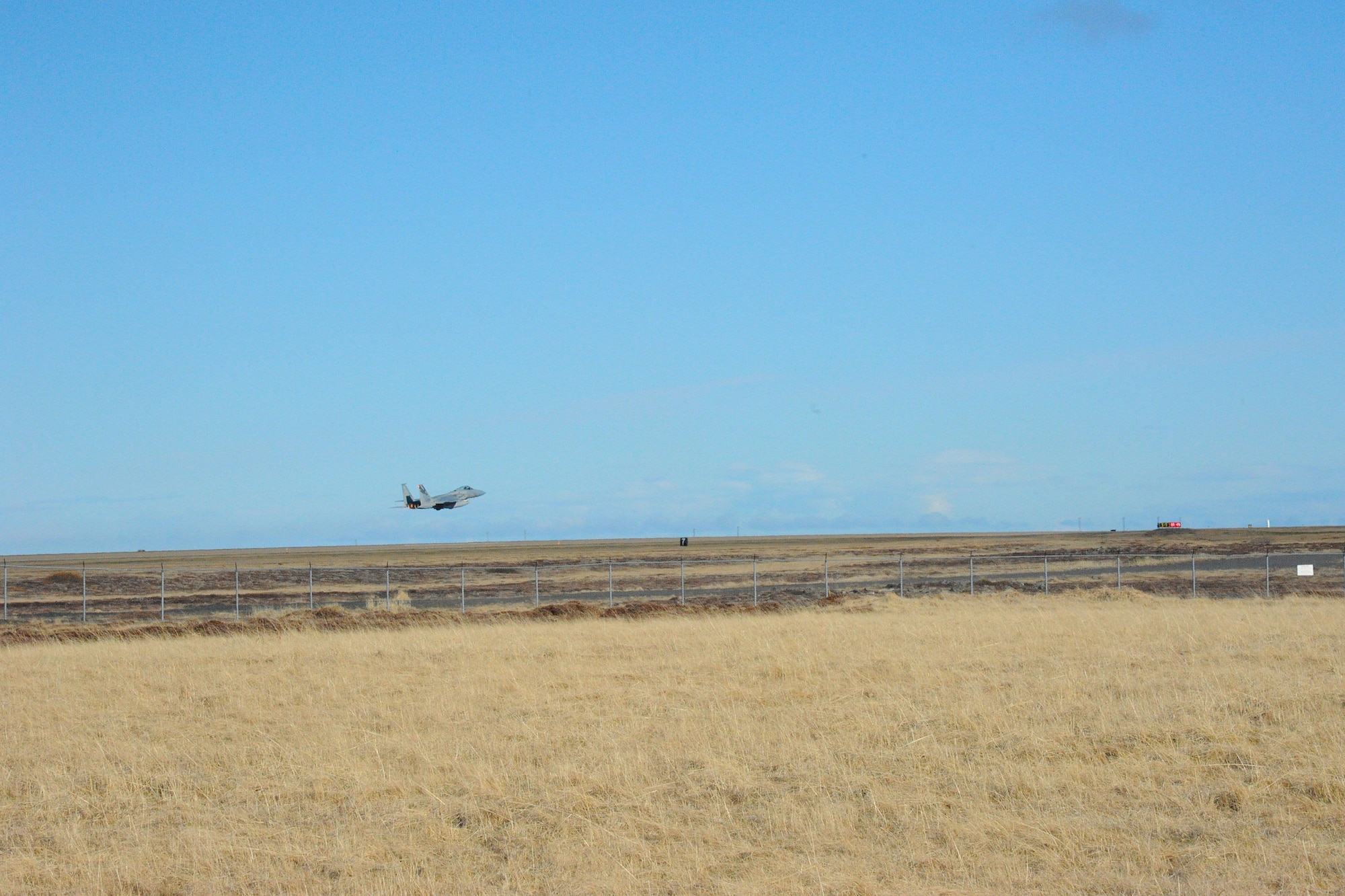 An F-15C Eagle fighter aircraft assigned to the 131st Fighter Squadron, Barnes Air National Guard Base, Mass., leaves the runway at Keflavik International Airport April 30, 2016. This was the first time the Icelandic Air Surveillance operation was honchoed under the Theater Security Package umbrella, using rotational forces of stateside Total Force Airmen and aircraft that augmented existing Air Force capabilities in Europe. (U.S. Air Force photo by Master Sgt. Kevin Nichols/Released)