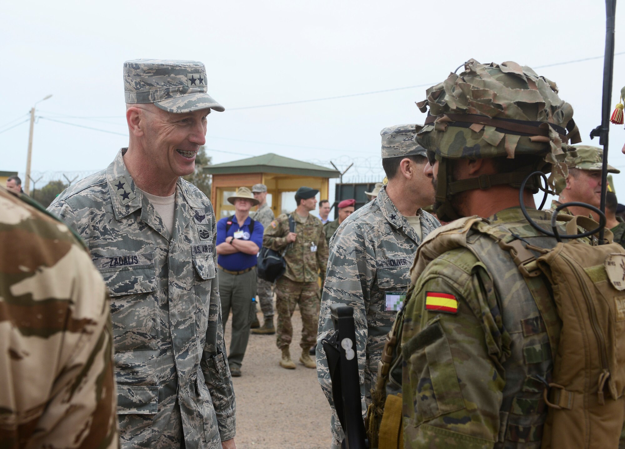 U.S. Air Force Maj. Gen. Timothy Zadalis, U.S. Air Forces in Europe-Air Forces Africa vice commander, speaks with a Spanish Legion army soldier during AFRICAN LION 16 at Tifnit, Kingdom of Morocco, April 26, 2016. The annual exercise involved familiarization with various countries military techniques to improve interoperability between countries. (U.S. Air Force photo illustration by Senior Airman Krystal Ardrey/Released)