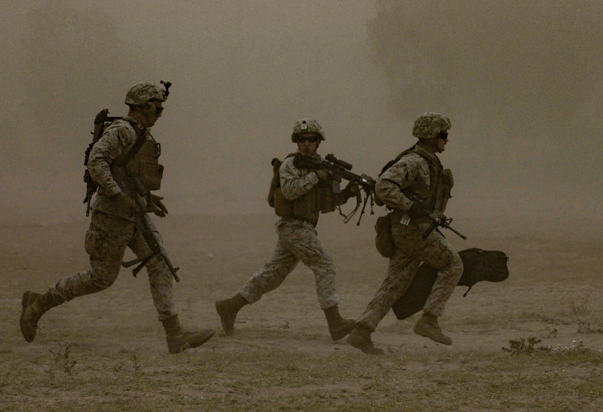 U.S. Marine Corps Marines with the Special-Purpose Marine Air-Ground Task Force Africa run across a field during a peace support operations demonstration as part of AFRICAN LION 16 at Tifnit, Kingdom of Morocco, April 26, 2016. The U.S. Marine Forces Europe-Africa and Kingdom of Morocco-led joint, combined exercise brought together 11 different countries to participate in a Combined Joint Task Force command post exercise and a peace support operations field training exercise to improve interoperability between countries. (U.S. Air Force photo by Senior Airman Krystal Ardrey/Released)