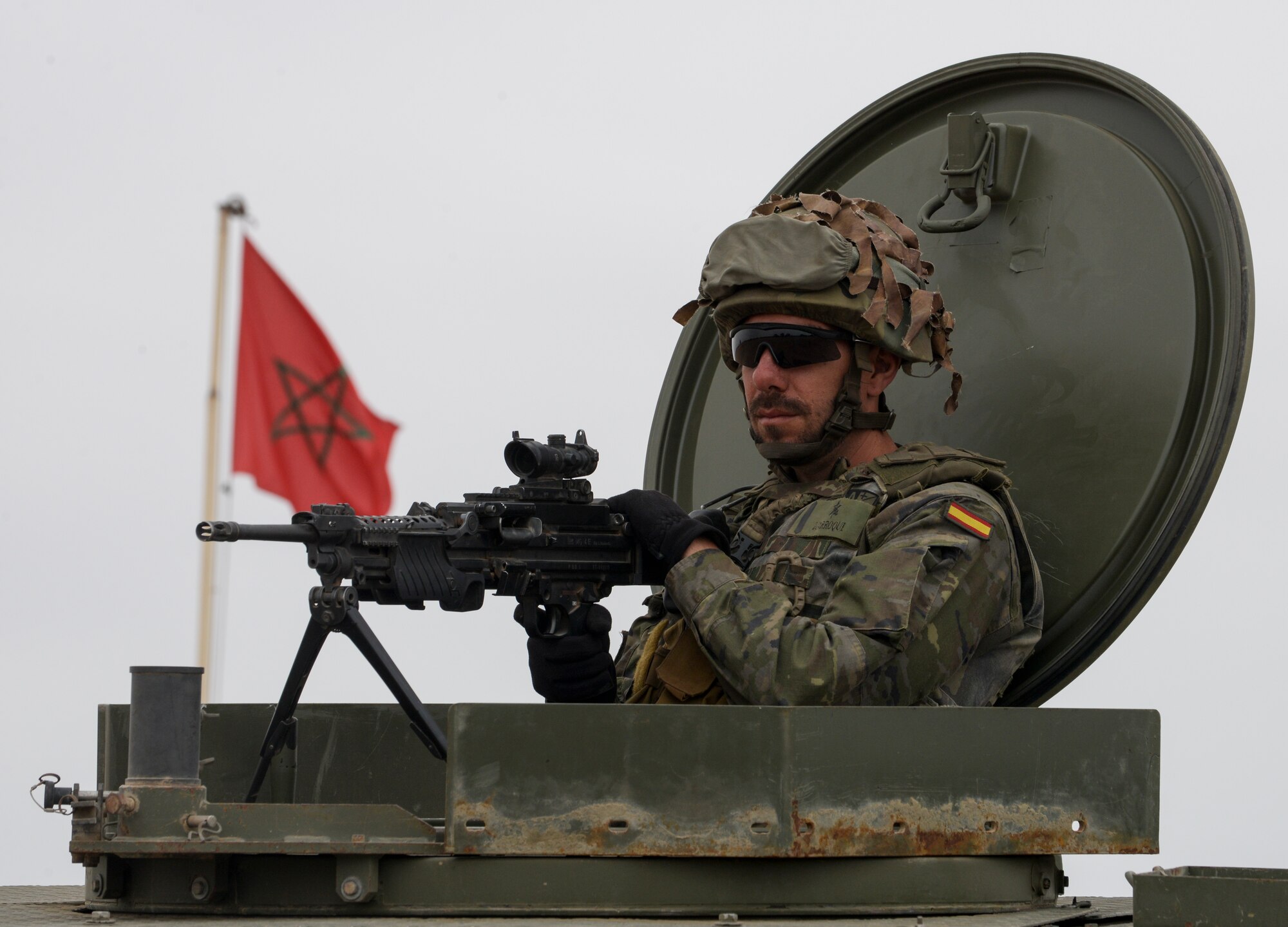 A Spanish Legion soldier provides security from the turret of a humvee while participating in a peace support operations demonstration during AFRICAN LION 16 at Tifnit, Kingdom of Morocco, April 26, 2016. The exercise provided familiarization with various military techniques from 11 different countries and provided an opportunity to become more familiar with allied nations’ tactics to ease synchronization in the future. (U.S. Air Force photo by Senior Airman Krystal Ardrey/Released)