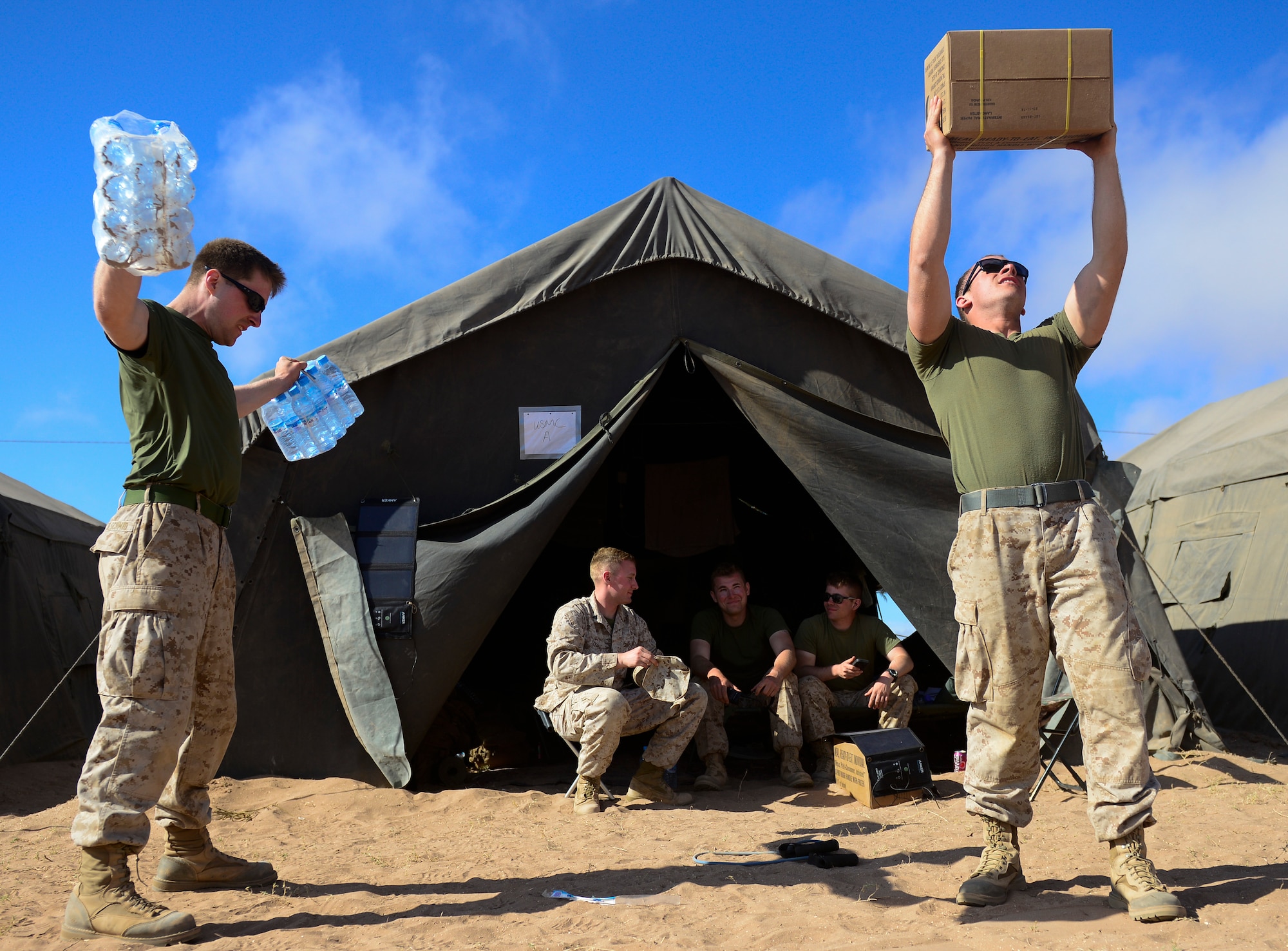 U.S. Marines from the 4th Law Enforcement Battalion work out using cases of water and boxes of meals ready-to-eat during AFRICAN LION 16 at Tifnit, Kingdom of Morocco, April 23, 2016. Of the 11 nations participating in the annual exercise, a group of U.S. military members, Royal Moroccan armed forces members, Spanish Legion soldiers and Royal Netherlands army soldiers lived in field conditions and participated in daily familiarization with other nations’ tactics to improve interoperability. (U.S. Air Force photo by Senior Airman Krystal Ardrey/Released)