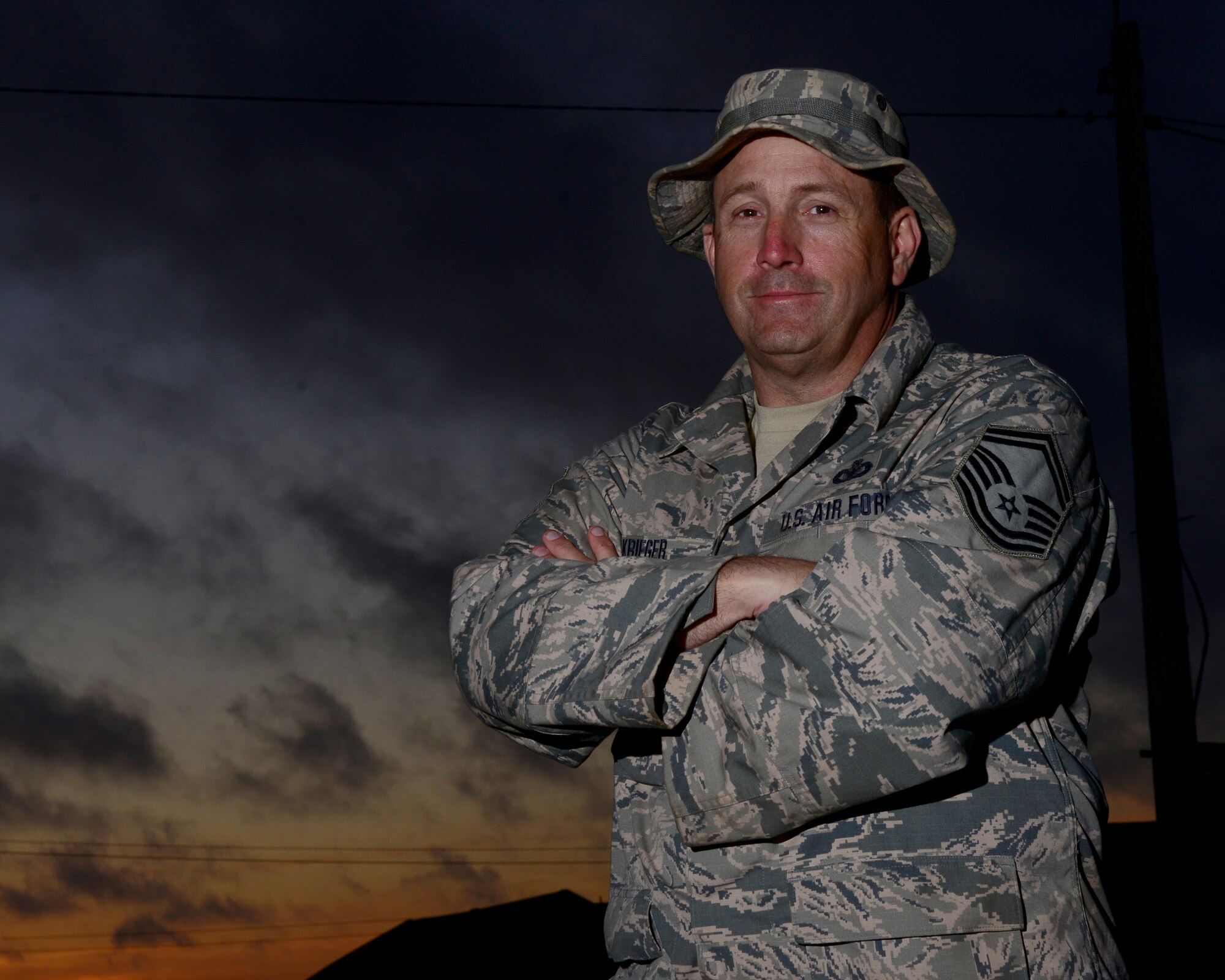 U.S. Air Force Senior MSgt. Klint Krieger, 403rd Security Forces Squadron exercise company first sergeant, stands outside his tent during AFRICAN LION 16 at Tifnit, Kingdom of Morocco, April 23, 2016. Krieger is an Air Force Reservist and the majority of the Air Force contingent are Air Force Reservists or Air Guardsmen. 400 U.S. service members joined with over 350 personnel from 10 other countries to create a foundation for future partnerships and provide training to all nations on command post activities and peace support operations. (U.S. Air Force photo by Senior Airman Krystal Ardrey/Released)