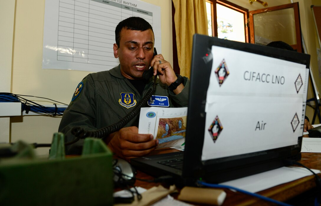 U.S. Air Force Maj. Sriram “Fuse” Krishnan, 414th Fighter Group exercise Joint Task Force air component liaison officer, works at his laptop during AFRICAN LION 16 at Inezgane, Kingdom of Morocco, April 23, 2016. Krishnan is an Air Force Reservist and the majority of the Air Force contingent, are Air Force Reservists or Air Guardsmen. 400 U.S. service members joined with over 350 personnel from 10 other countries to create a foundation for future partnerships and provide training to all nations on command post activities and peace support operations. (U.S. Air Force photo by Senior Airman Krystal Ardrey/Released)