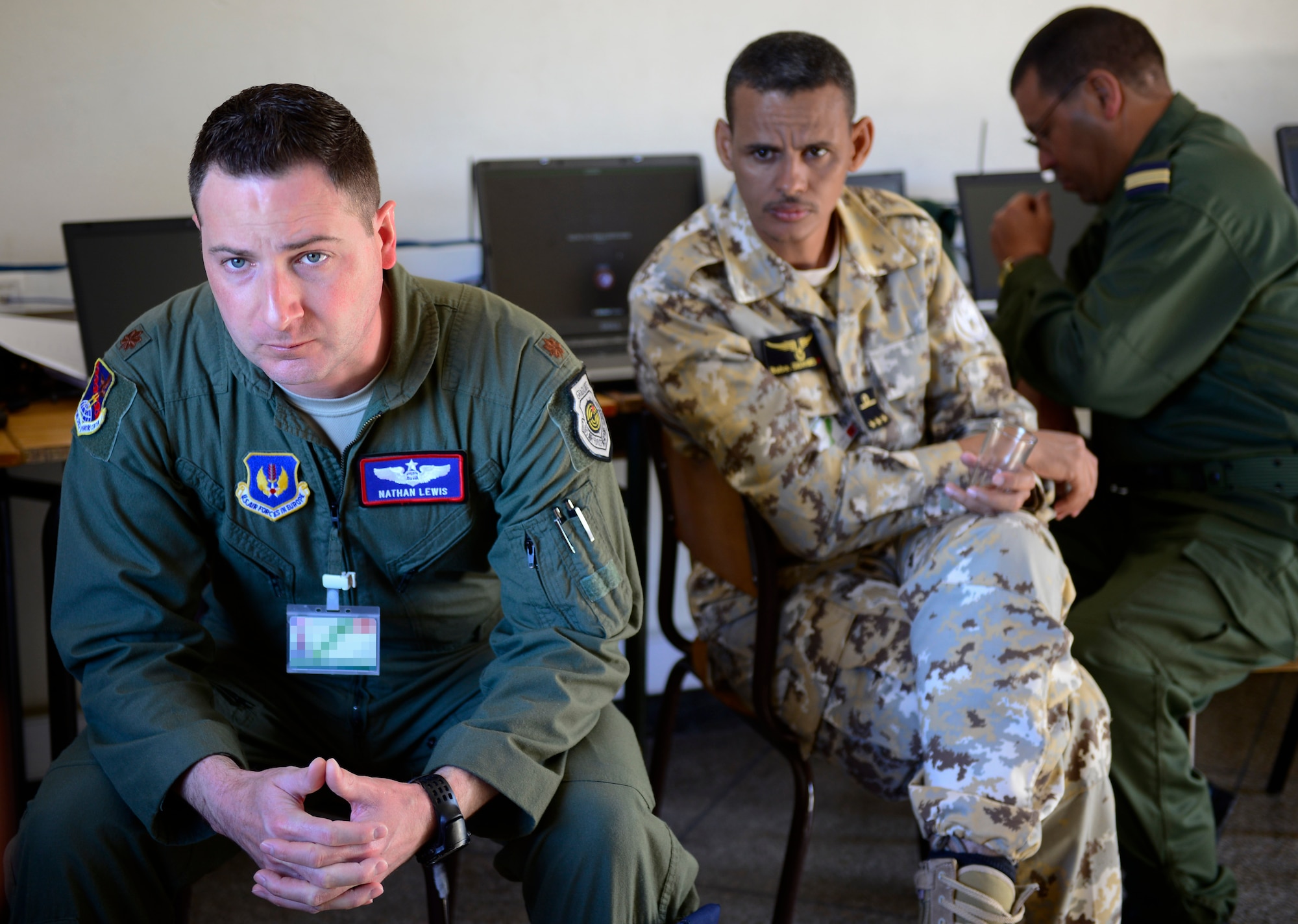 U.S. Air Force Maj. Nathan Lewis, 603rd Air and Space Operations Center Exercise Combined Joint Air Command staff member, discusses the upcoming exercise for AFRICAN LION 16 with military members from other nations at Inezgane, Kingdom of Morocco, April 23, 2016. Lewis is an Air Force Reservist. The majority of the Air Force contingent are Air Force Reservists or Air Guardsmen. 400 U.S. service members joined with over 350 personnel from 10 other countries to create a foundation for future partnerships and provide training to all nations on command post activities and peace support operations. (U.S. Air Force photo by Senior Airman Krystal Ardrey/Released)