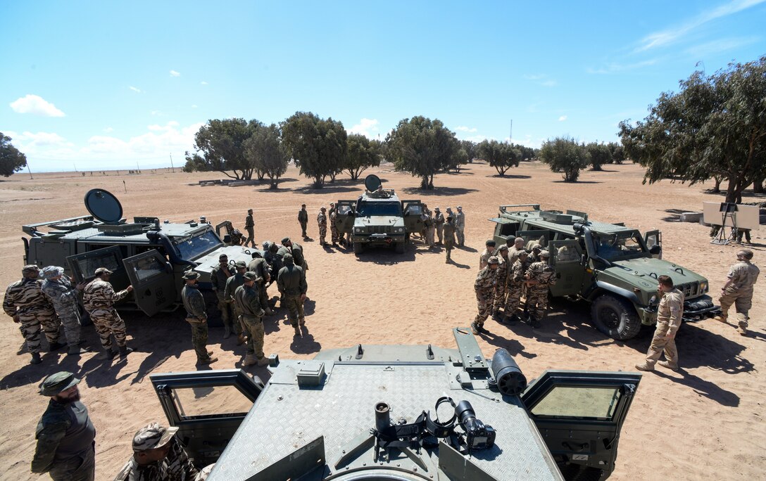 Participants of AFRICAN LION 16 examine Humvees from different countries at Tifnit, Morocco, April 20, 2016. The training began with vehicle familiarization and concluded with an exercise in convoy operations. (U.S. Air Force photo by Senior Airman Krystal Ardrey/Released)