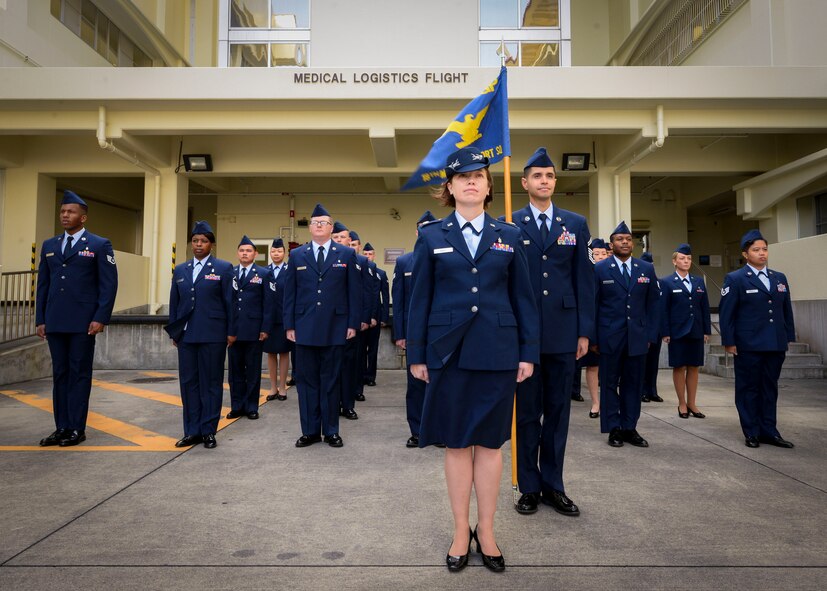 Airmen of the 18th Medical Logistics Flight stand in formation during an open ranks inspection April 28, 2016, at Kadena Air Base, Japan. They received the Air Force Medical Logistics Small Account of the Year Award for 2015. The award recognizes the flight’s ability to provide and sustain pharmaceutical, medical and surgical supplies, medical devices and equipment as well as other products that support doctors, nurses, and other health and dental care providers. (U.S. Air Force photo by Senior Airman John Linzmeier) 