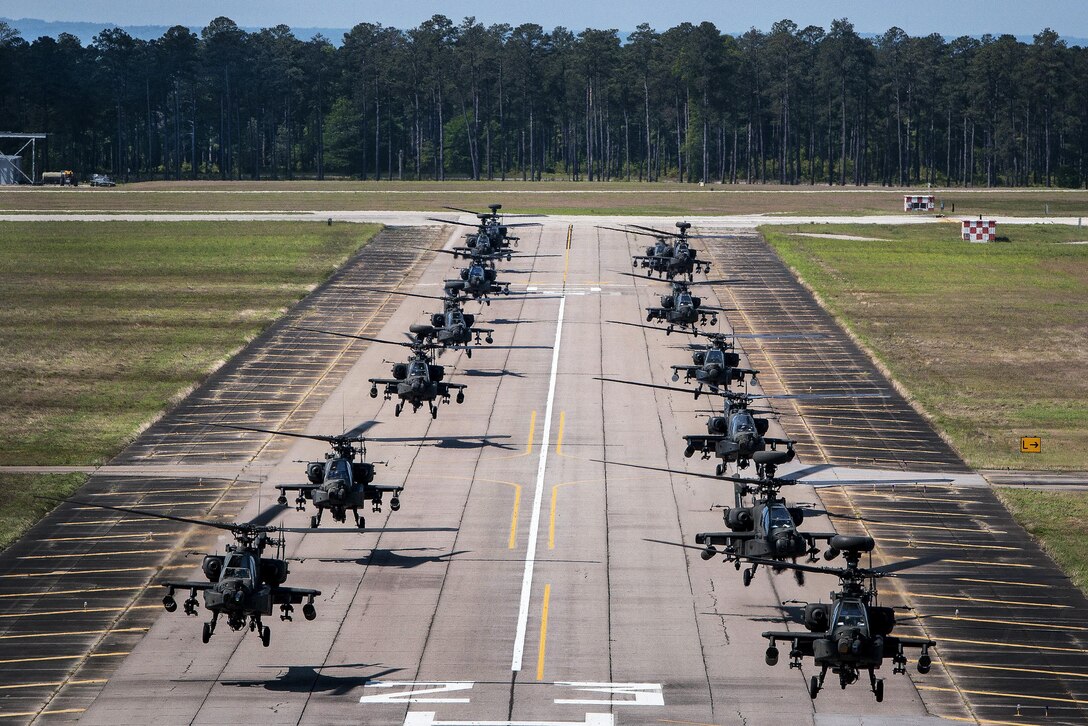AH-64D Apache helicopters begin to depart in formation from McEntire Joint National Guard Base, Eastover, S.C., April 23, 2016, to participate in gunnery qualifications and annual training at Fort Stewart, Ga. South Carolina Army National Guard photo by Staff Sgt. Roberto Di Giovine