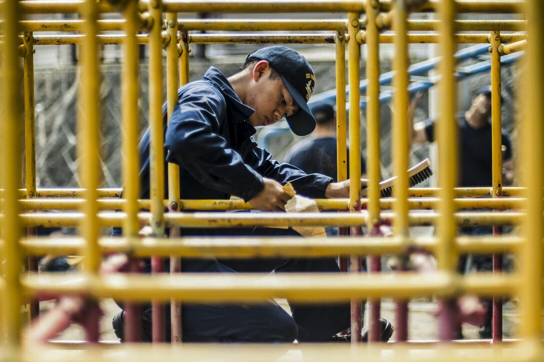 Navy Seaman Apprentice Joseph John Rabe sands playground equipment during a community relations event at an orphanage in Yokosuka, Japan, May 2, 2016. Rabe is assigned to the USS Ronald Reagan, which is deployed to defend the collective maritime interests of the United States and its allies and partners in the Indo-Asia-Pacific region. Navy photo by Seaman Jamaal N. Liddell