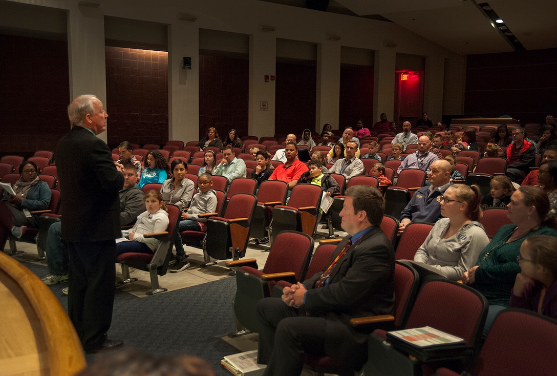 Acting Land and Maritime Commander James McClaugherty welcomes more than 150 parents and children to the installation’s Take Your Child to Work Day. McClaugherty stressed recognition of the parents as heros as ‘the main understanding’ the children during his welcome remarks.