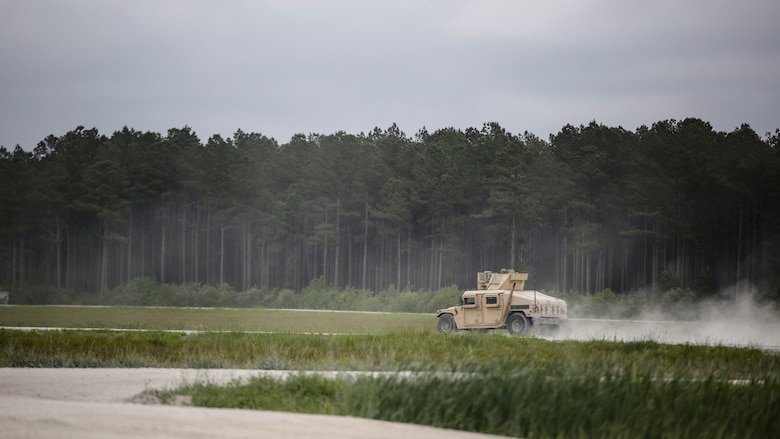A Humvee, operated by Marines with Headquarters and Service Company, 2nd Tank Battalion, moves down range during a field exercise at Marine Corps Base Camp Lejeune, North Carolina, April 29, 2016. The company divided Marines into three groups to occupy the range for duration of two weeks in order for each Marine to be able to participate in the training. 
