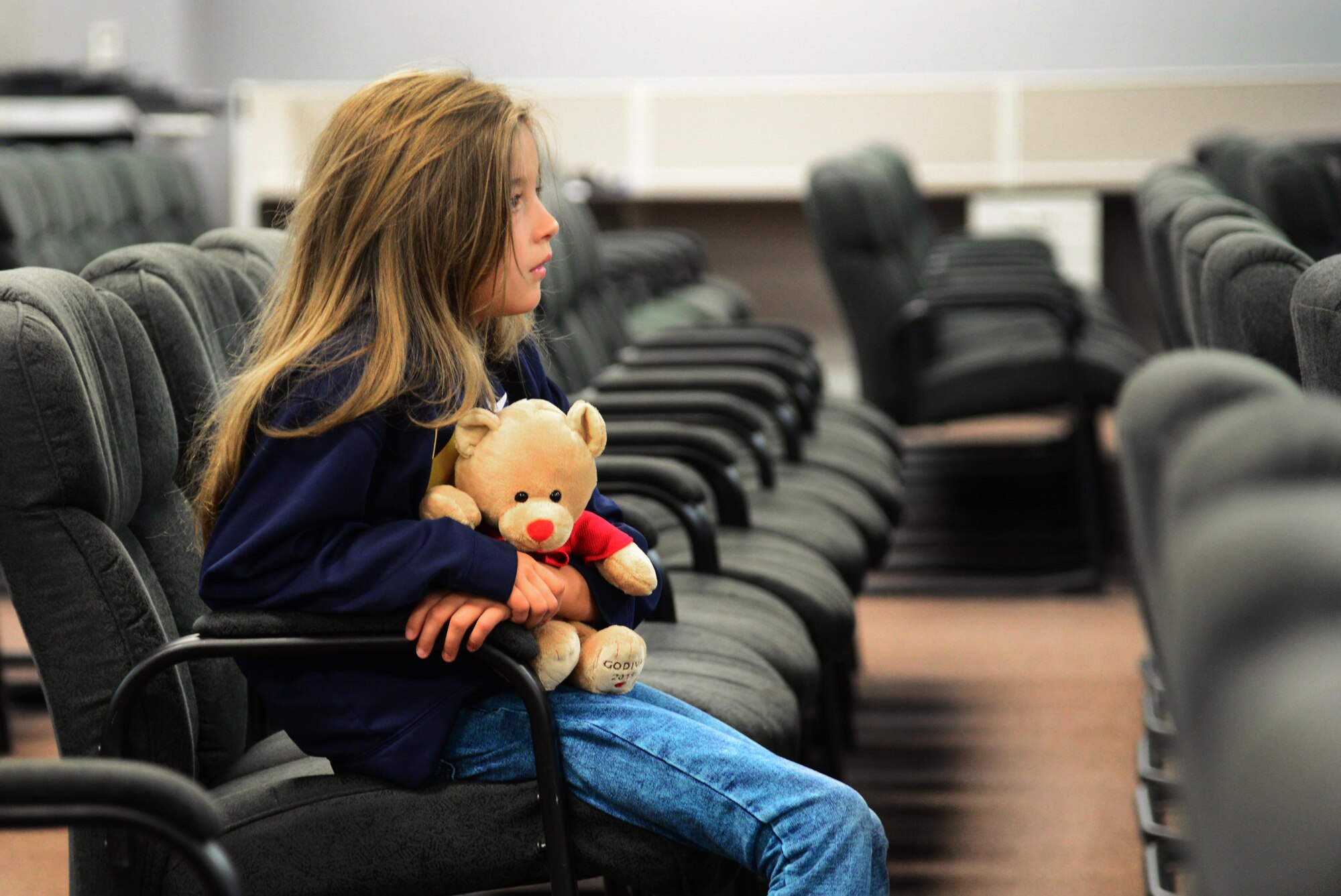 A child waits in the pre-deployment processing room before the kick-off of Operation KUDOS (Kids Understanding Deployment Operations) April 30, 2016, at Cannon Air Force Base, N.M. The day-long event was designed to provide children a first-hand view of what their parents go through in order to prepare for a deployment. (U.S. Air Force photo/Staff Sgt. Alexx Pons) 