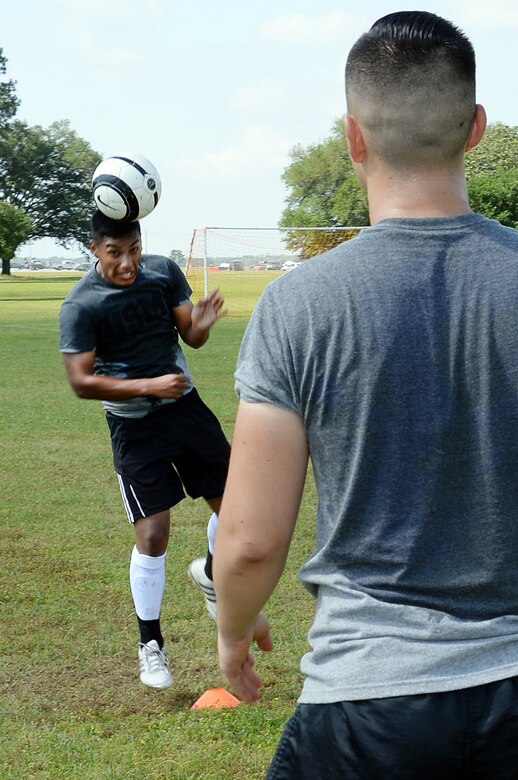 Cpl. Jesus Flores, team member, All-Marine Men’s Soccer Team, practices hitting the soccer ball with his head back to his partner during the All-Marine Men’s Soccer Team tryouts aboard Marine Corps Logistics Base Albany, Ga., April 26. Flores is a warehouse clerk with 2nd Tank Battalion, 2nd Marine Division, Camp Lejeune, N.C.