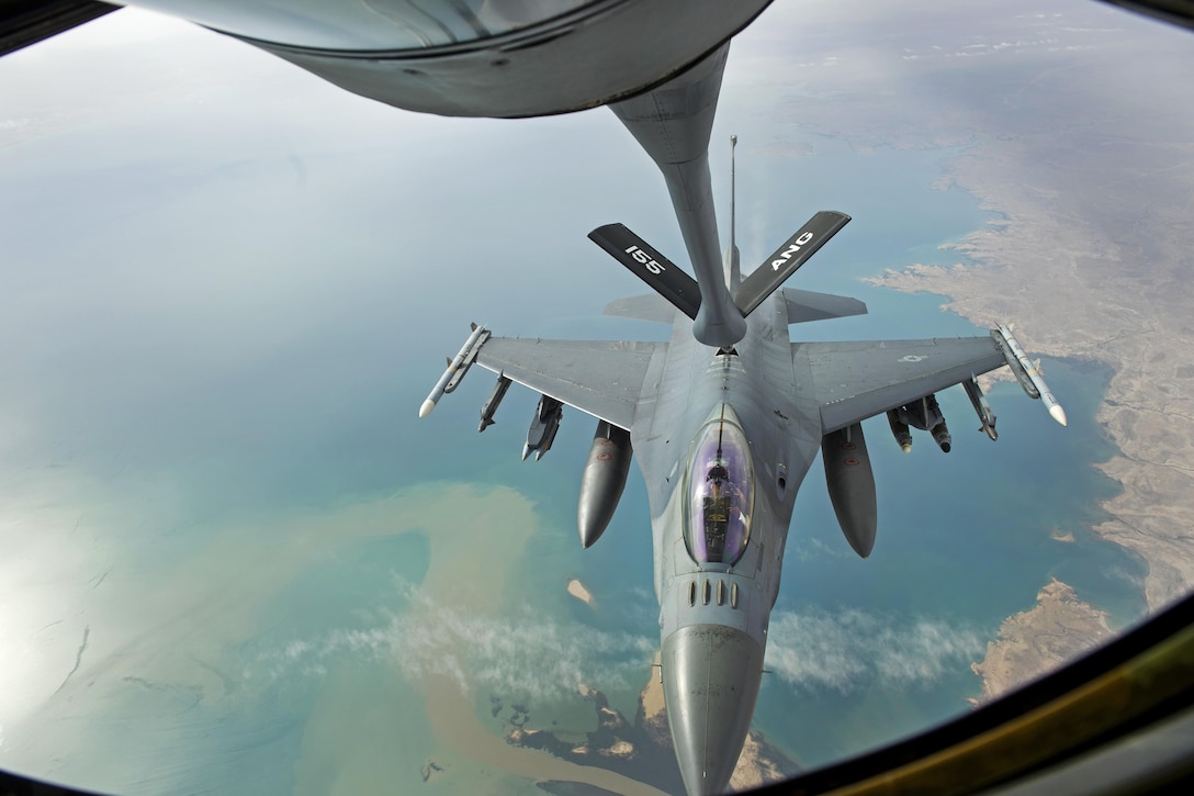 An Air Force F-16 Fighting Falcon supporting Operation Inherent Resolve receives fuel from a KC-135R Stratotanker aircraft over Iraq, April 29, 2016. Air Force photo by Staff Sgt. Douglas Ellis