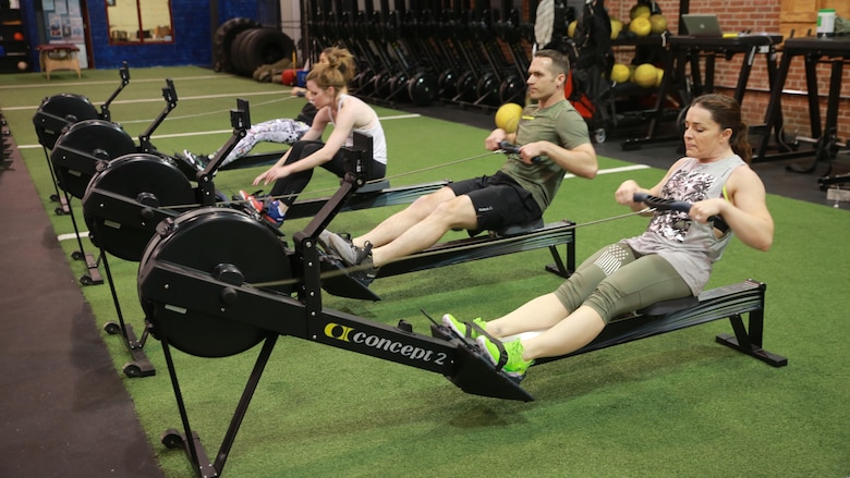 Major Misty Posey, right, participates in a workout at the Reebok Headquarters' Honor Your Days event in Canton, Massachusetts, April 28, 2016. The workout followed a panel discussion where Reebok showed their new television spot to those in attendance. Posey was invited to the event as a strong female figure due to her accomplishments in the Marine Corps. Posey came up with a program to help men and women increase their number of pull-ups. She says she hopes to spread the word about her program to help men and women across the nation.