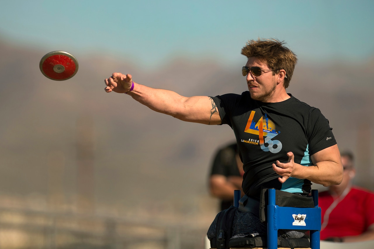 Medically retired Army Staff Sgt. Timothy Payne competes in seated discus during the Army Trials at Fort Bliss, Texas, April 1, 2015. Payne is slated to compete at the 2016 Invictus Games held May 8-12 at the ESPN Wide World of Sports Complex at Walt Disney World in Orlando, Florida. DoD photo by EJ Hersom