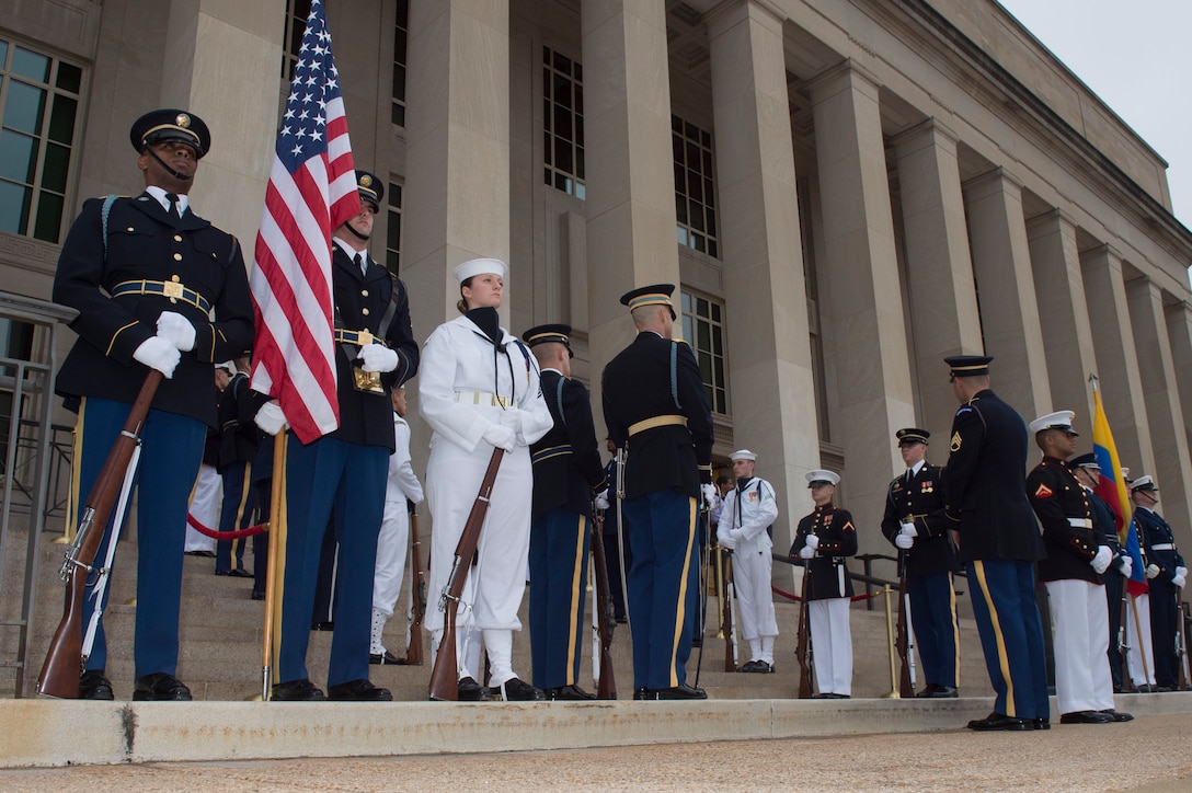 Members of a joint honor guard stand at parade rest as Deputy Defense Secretary Bob Work prepares to host an honor cordon welcoming Colombian Defense Minister Luis Carlos Villegas to the Pentagon, May 4, 2016. DoD photo by Air Force Senior Master Sgt. Adrian Cadiz
