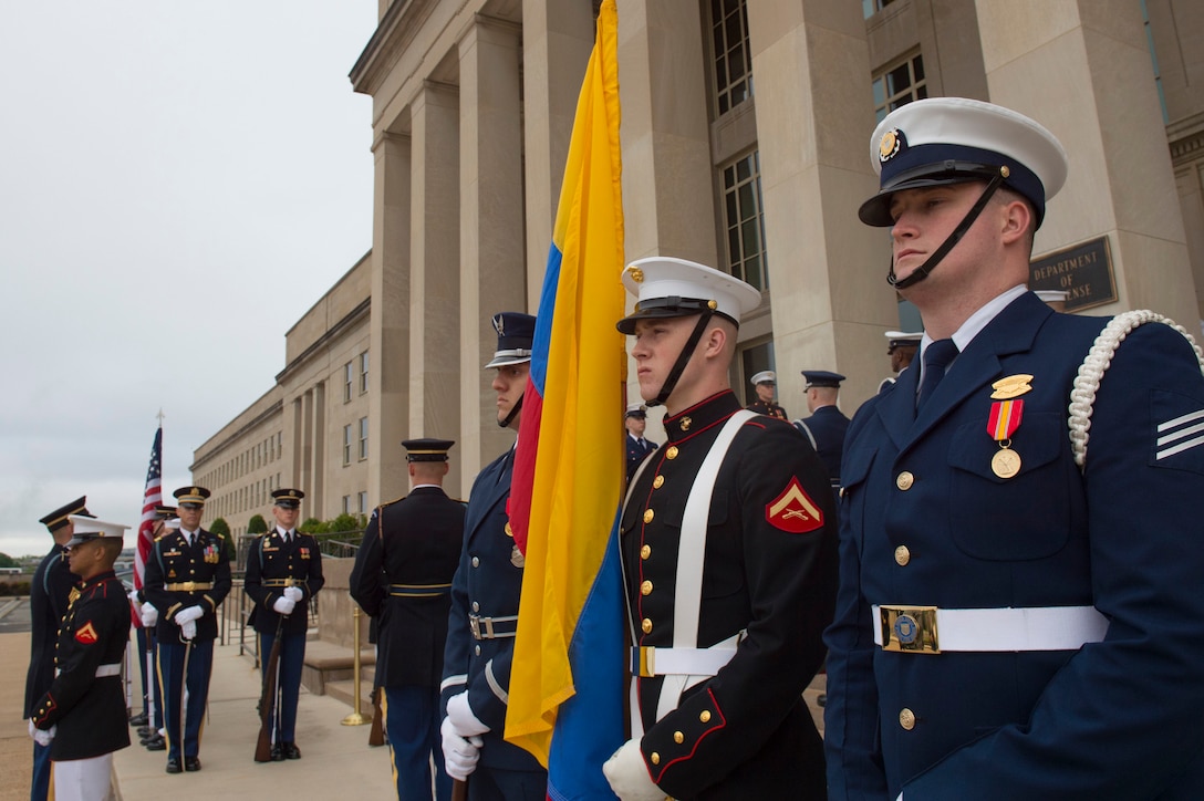 Members of a joint honor guard stand at parade rest as Deputy Defense Secretary Bob Work prepares to host an honor cordon welcoming Colombian Defense Minister Luis Carlos Villegas to the Pentagon, May 4, 2016. DoD photo by Air Force Senior Master Sgt. Adrian Cadiz