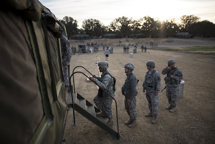 U.S. Army Reserve and National Guard Soldiers line up to eat breakfast in the field at Forward Operating Base Schoonover at Fort Hunter-Liggett, California, May 3. Approximately 80 units from across the U.S. Army Reserve, Army National Guard and active Army are participating in the 84th Training Command's second Warrior Exercise this year, WAREX 91-16-02, hosted by the 91st Training Division at Fort Hunter-Liggett, California. (U.S. Army photo by Master Sgt. Michel Sauret)