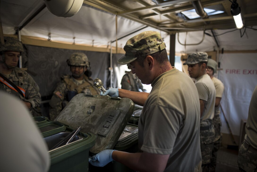 U.S. Army Reserve Soldiers from the 490th Quartermaster Company and the 238th Transportation Company serve a hot breakfast to fellow Soldiers training on Forward Operating Base Schoonover at Fort Hunter-Liggett, California, May 3. Approximately 80 units from across the U.S. Army Reserve, Army National Guard and active Army are participating in the 84th Training Command's second Warrior Exercise this year, WAREX 91-16-02, hosted by the 91st Training Division at Fort Hunter-Liggett, California. (U.S. Army photo by Master Sgt. Michel Sauret)