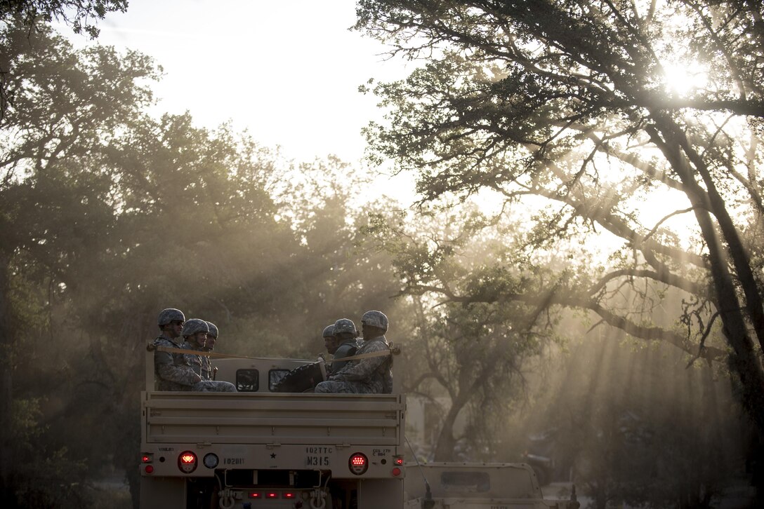 A group of U.S. Army Reserve Soldiers ride on the back of a troop-carrier truck after eating breakfast to go training on Fort Hunter-Liggett, California, May 3. Approximately 80 units from across the U.S. Army Reserve, Army National Guard and active Army are participating in the 84th Training Command's second Warrior Exercise this year, WAREX 91-16-02, hosted by the 91st Training Division at Fort Hunter-Liggett, California. (U.S. Army photo by Master Sgt. Michel Sauret)