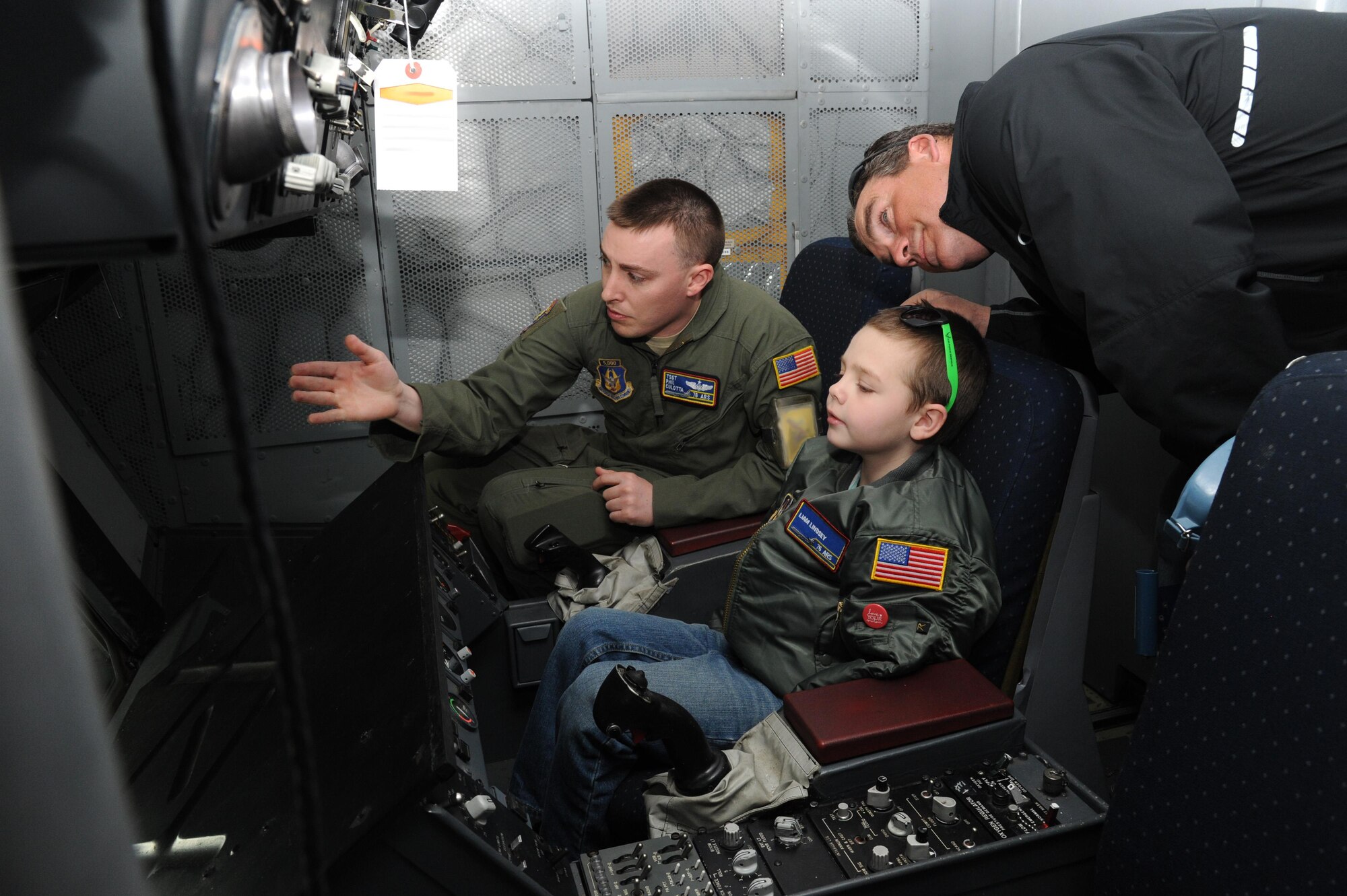 Staff Sgt. Phillip Culotta, a Reserve KC-10 boom operator with the 76th Air Refueling Squadron, explains the refueling process to the guest of honor and his father during the April 17 visit. 