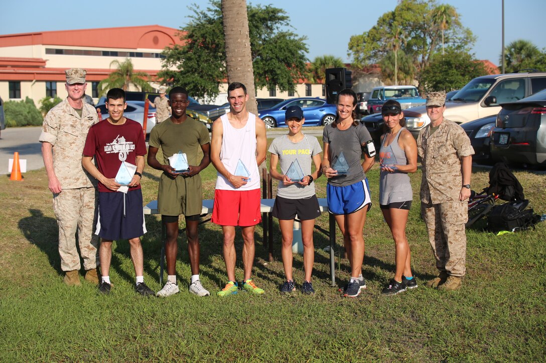 The Marines and Sailors of Marine Corps Forces Central Command hosted a 5K, April 29, to recognize April as Sexual Assault Awareness Prevention Month.  More than 200 service members and family members ran to support fighting sexual harassment and creating awareness for bystander intervention. 
Pictured left to right, Col. Brad Close, MARCENT Chief of Staff and grand marshal of the run, Army Specialist Chris Ubias (Male 3rd place: 19:59), Marine Lance Cpl.  Lenadjah White (Male 2nd place 19:18), Air Force Senior Airman Matthew Altimari (Male 1st Place: 18:16), Navy Electrician Tech 1st Class Valerie Blasewitz (Female 1st place: 22:34), Ms. Betsy Allen (Female 2nd place: 24:39), Ms. Theresa Winterhalter (Female 3rd place: 25:00), and Lt. Col. Maureen Murphy, MARCENT's senior administrative officer and event organizer.
"We were very happy to have hosted more than 200 runners to bring in the month of events on a high note," said Murphy.  "Even if just one participant from today's run steps up to prevent even one case of sexual harassment, we consider our event a huge success."
