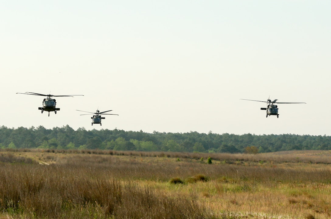 Three UH-60 Black Hawk helicopters and paratroopers participate in an air assault mission as part of a training exercise to repair damaged airfields at Fort Bragg, N.C., April 27, 2016. Army photo by Sgt. Juan F. Jimenez