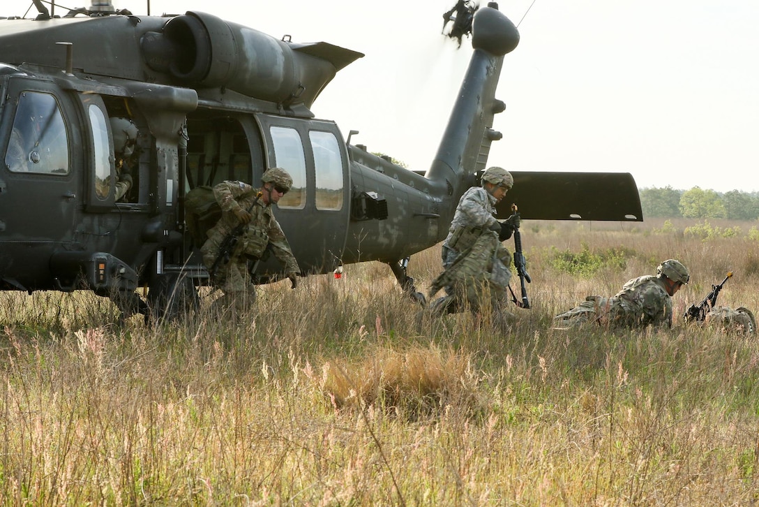 Paratroopers exit a UH-60 Black Hawk helicopter during an air assault mission as part of a training exercise to repair damaged airfields at Fort Bragg, N.C., April 27, 2016. Army photo by Sgt. Juan F. Jimenez