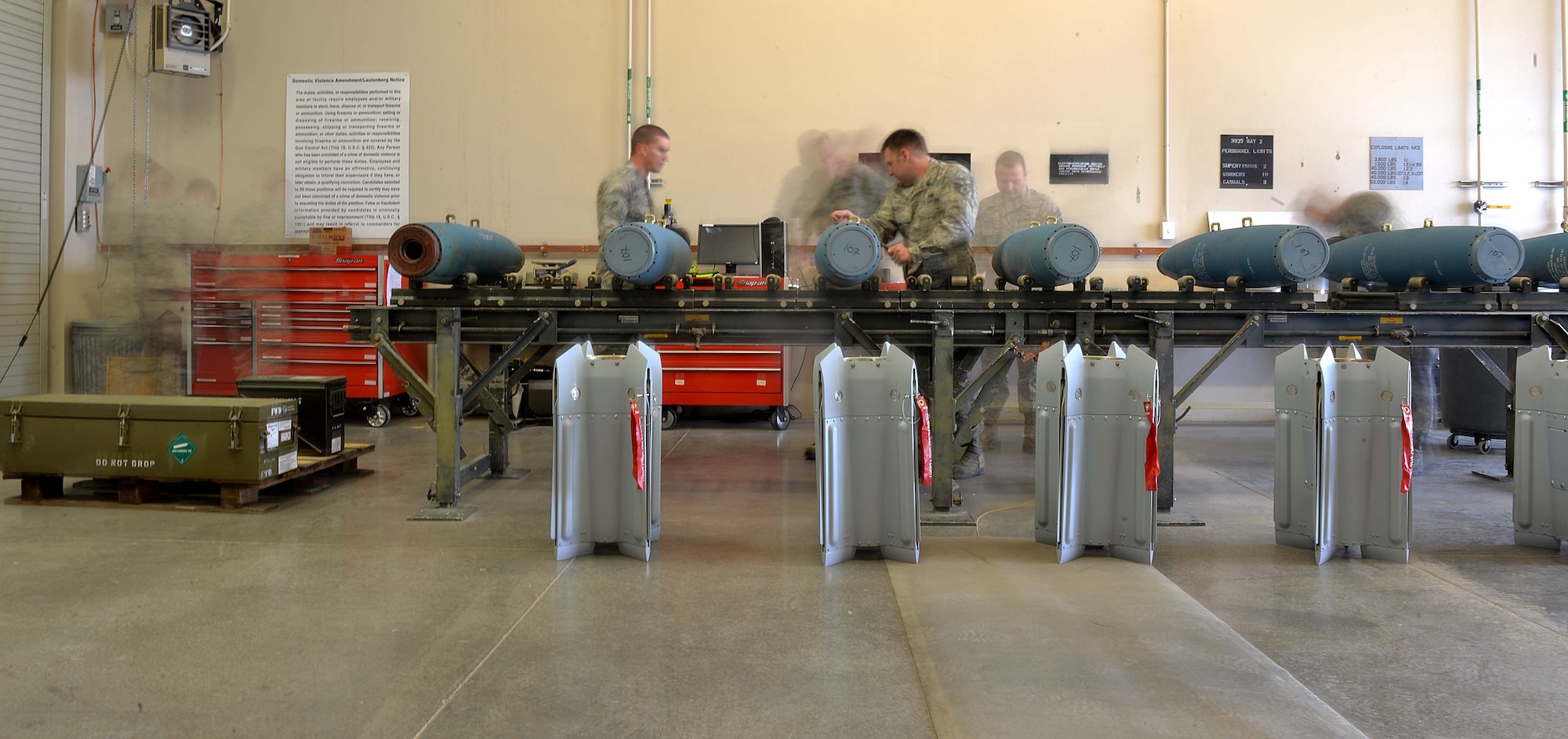 The 432nd Maintenance Squadron’s munitions flight performs maintenance on six inert GBU-12 Paveway II laser-guided bombs April 27, 2016, at Creech Air Force Base, Nevada. Col. Case Cunningham, 432nd Wing/432nd Air Expeditionary Wing commander, and Chief Master Sgt. Michael Ditore, 432nd Wg/432nd AEW command chief, assisted in the build to connect with munitions Airmen and learn various parts of their jobs, as well as their contributions to the MQ-1 and MQ-9 mission. (U.S. Air Force photo by Airman 1st Class Kristan Campbell/Released).