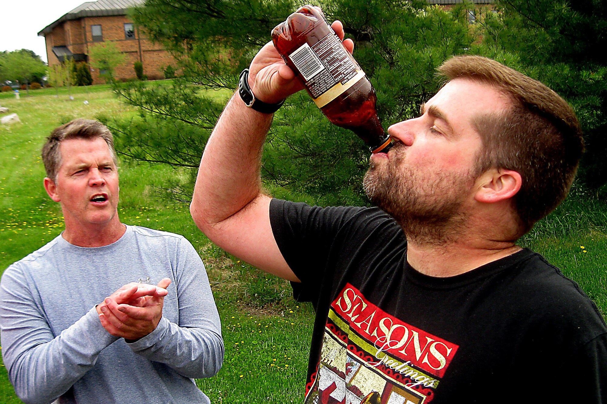 Zachery Holmes, 434th Force Support Squadron, finishes drinking a root beer during the 2016 Plastic Egg Run April 27, 2016 at Grissom Air Reserve Base, Ind. Drinking the entire bottle was the challenge that his team had to complete at one of the stops before continuing the run. (U.S. Air Force photo/Senior Airman Dakota Bergl)