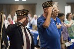 Retirees salute the colors during the playing of the National Anthem during the Retiree Activity Fair April 23 at Joint Base San Antonio-Randolph. The JBSA-Randolph Retiree Activities Office is run by volunteers whose purpose is to serve the needs of military retirees, spouses, widows and widowers. (U.S. Air Force photo by Senior Airman Stormy Archer/RELEASED)

