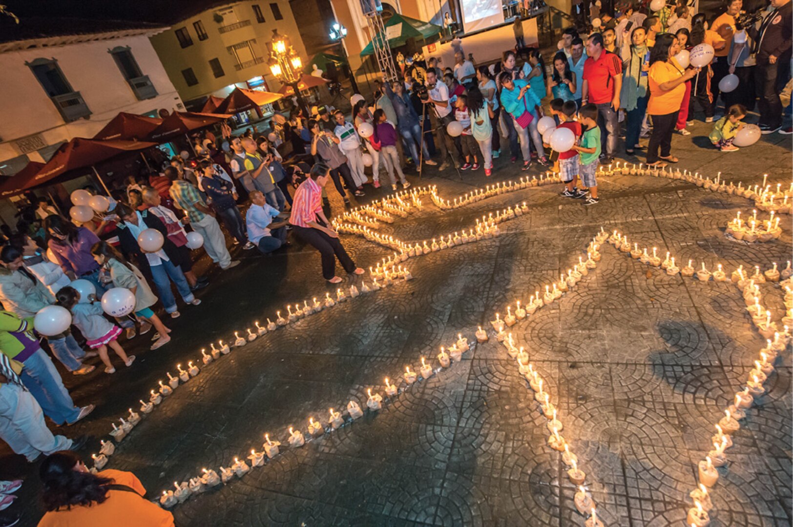 Locals participate in an act of symbolic reparations in Antioquia, a state located in
central northwestern Colombia.
