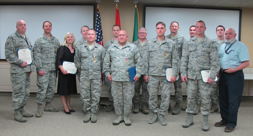 JOINT BASE LEWIS-MCCHORD, Wash. -- The Western Air Defense Sector held its quarterly awards and decorations ceremony May 1.  Recipients included (from left to right): Tech. Sgt. Ricardo Camacho, Category II Enlisted DSG of the Quarter; Master Sgt. Joshua Carruthers, Air Force Commendation Medal; Tech. Sgt. Elizabeth Aguirre, Air Force Commendation Medal; Tech. Sgt. Ryan McCray, Air Force Commendation Medal; Capt. Tyler Royster, Air Force Commendation Medal; Major Jill Lathrop, Meritorious Service Medal;  Capt. Douglas Johnson, Air Force Commendation Medal; Tech Sgt. Rivanita Noyes, Air Force Commendation Medal,  Staff Sgt. Mark Kegley, Category I Enlisted DSG of the Quarter; Staff Sgt. Adaryll Blackwell, Air Force Achievement Medal; 2nd Lt. James Hughes, Air Force Commendation Medal.