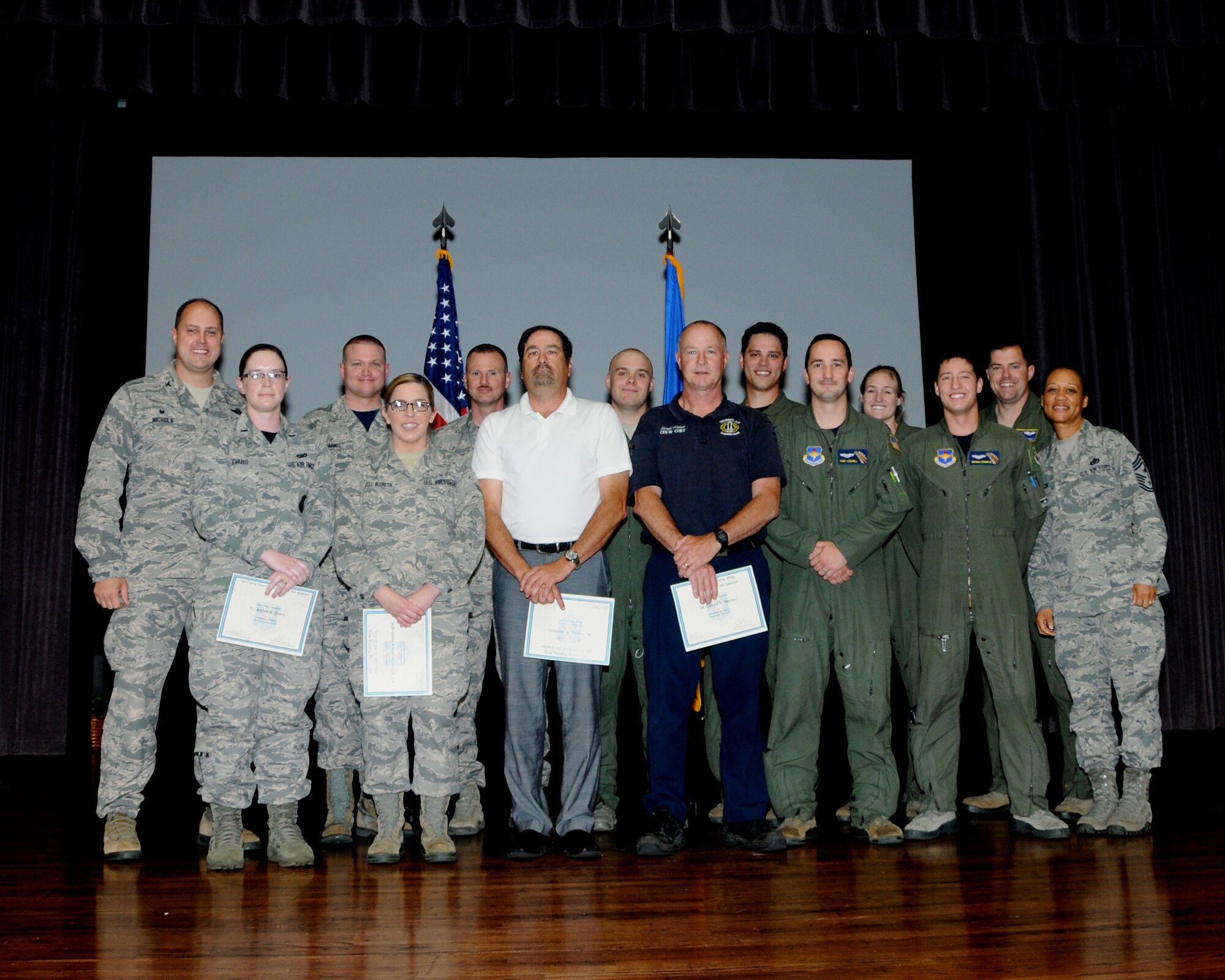 The 2016 first quarterly awards winners or their representatives pause for a photo on stage at Kaye Auditorium April 29 on Columbus Air Force Base, Mississippi. The ceremony honored the wing’s outstanding professionals for the months of January through March 2016 whose drive, determination and dedication have earned them this recognition. (U.S. Air Force Photo/Melissa Doublin)