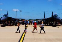 Families and friends enjoy the 2016 Defenders of Liberty Airshow at Barksdale Air Force Base, La., April 30. The air show boasted a variety of aircraft performances and displays as well as inflatables for children. (U.S. Air Force photo/Airman 1st Class Luke Hill)