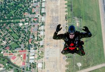 A member of the SkyHawks, a Canadian Forces parachute team, jumps out of a SC-7 Skyvan during the 2016 Defenders of Liberty Air Show at Barksdale Air Force Base, La., April 30. The SkyHawks are Canada’s only military parachute demonstration team. For over 40 years, they have represented Canada and the Canadian Armed Forces to over 75 million spectators worldwide under their signature Canadian flag parachutes. (U.S. Air Force photo/Senior Airman Mozer O. Da Cunha)