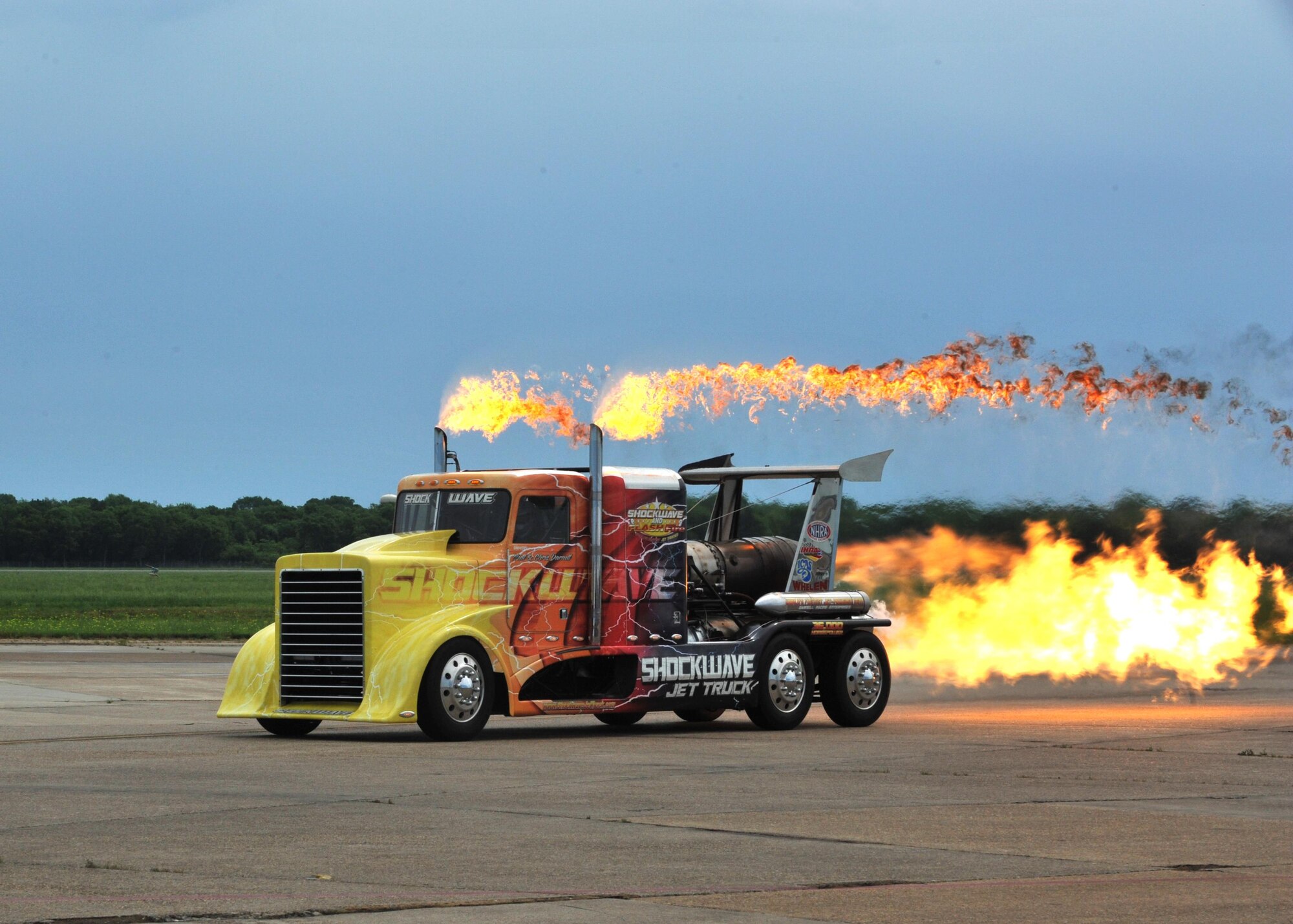The Shockwave Jet Truck emits a blast of fire during the 2016 Defenders of Liberty Airshow at Barksdale Air Force Base, La., April 30. Shockwave is a tractor-trailer rig equipped with three Pratt & Whitney J34-48 jet engines producing 36,000 horsepower. Capable of speeds up to 376 mph, Shockwave is the Guinness Book of World Records record holder for the fastest truck in the world. (U.S. Air Force photo/Senior Airman Joseph Raatz)