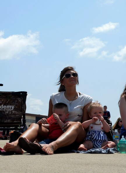 Spectators observe aerobatic performances during the 2016 Defenders of Liberty Airshow at Barksdale Air Force Base, La., May 1. The air show aims to educate the public on past and present Air Force aerial capabilities, increase recruiting and show appreciation to the local community. (U.S. Air Force photo/Senior Airman Amanda Morris)