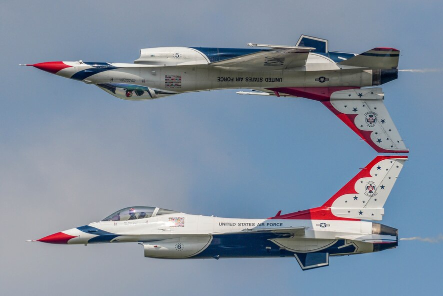 Maj. Alex Turner, Thunderbird 6 pilot, and Capt. Nicholas Eberling, Thunderbird 5 pilot, perform a Calypso Pass during the 2016 Defenders of Liberty Airshow at Barksdale Air Force Base, La., May 1. The Thunderbirds performed twists, turns and rolls at high speeds demonstrating the prowess and capabilities of the F-16 Fighting Falcon. (U.S. Air Force photo/Senior Airman Mozer O. Da Cunha)