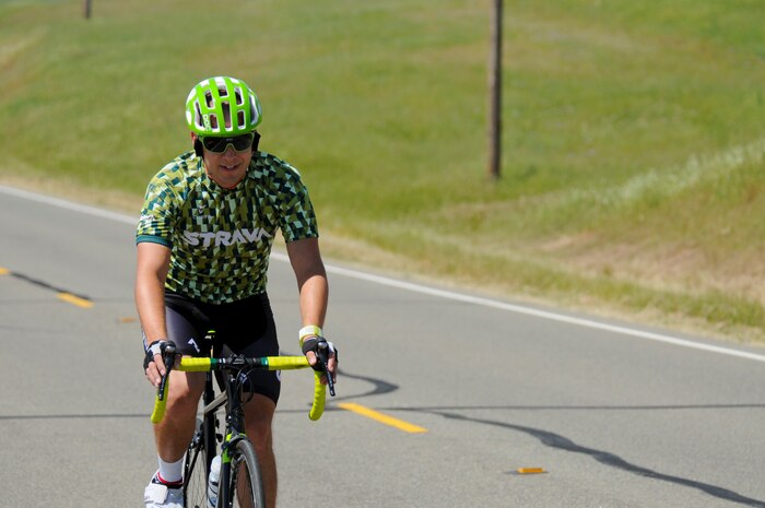 Staff Sgt. Andrew Bergdorf, 9th Civil Engineer Squadron power production supervisor, rides his road bike on Beale Air Force Base, California, April 19, 2016. Bergdorf has been selected to compete in the Department of Defense Wounded Warrior Games which will take place at the U.S. Military Academy in West Point, New York, June 14-22, 2016. (U.S. Air Force photo by Senior Airman Michael J. Hunsaker)