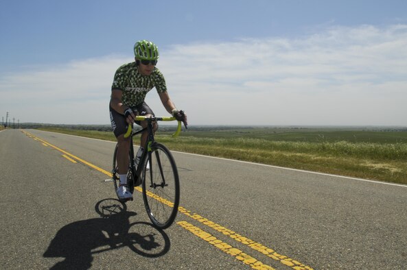 Staff Sgt. Andrew Bergdorf, 9th Civil Engineer Squadron power production supervisor, rides his road bike on Beale Air Force Base, California, April 19, 2016. Bergdorf has been selected to compete in the Department of Defense Wounded Warrior Games which will take place at the U.S. Military Academy in West Point, New York, June 14-22, 2016. (U.S. Air Force photo by Senior Airman Michael J. Hunsaker) 