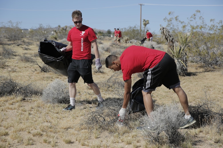 Lance Cpl. Wyatt Looslivaltrahis and Pfc. Isaiah Ringoen, students, Marine Corps Communication-Electronics School, helps restore the Gateway Parcel during the Mojave Desert Land Trust Earth Day Restoration in Joshua Tree, Calif., April 23, 2016. (Official Marine Corps photo by Pfc. Dave Flores/Released)