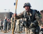 Sgt. Bueno Genaro, 65th Medical Brigade, completes the final portion of the 12-mile ruck march at Warrior Base near Panmunjeom, South Korea Apr. 29,2016. The ruck march was conducted as the final event during the Expert Field Medical Badge training event. The "EFMB on the DMZ" was a two-week training event that tested medical Soldiers' ability to perform a variety of medical tasks to standard. Of the 158 candidates that started the training, only 20 were able to pass all the tests succesfully and earn the EFMB. 