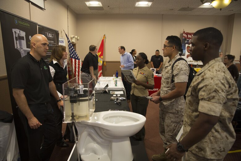 Vendors demonstrate water sustainability products to Marines during the Combat Center’s Sustainability Expo at the Frontline Restaurant April 26, 2016. (Official Marine Corps photo by Cpl. Connor Hancock/Released)