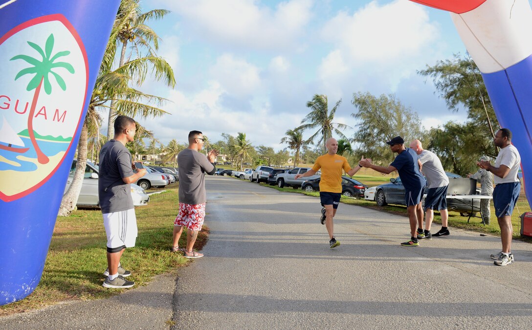 U.S. Navy Chief Petty Officer Jonathan Fischer, Helicopter Sea Combat Squadron 25 won first place during the Asian American Pacific Islander Heritage Month 5K May 4, 2016, at Andersen Air Force Base, Guam. The 5K marked the first event to occur during Asian American Pacific Islander Heritage Month, honoring the contributions of Asian Americans and Pacific islanders nationwide. (U.S. Air Force photo by Airman 1st Class Arielle Vasquez/Released)